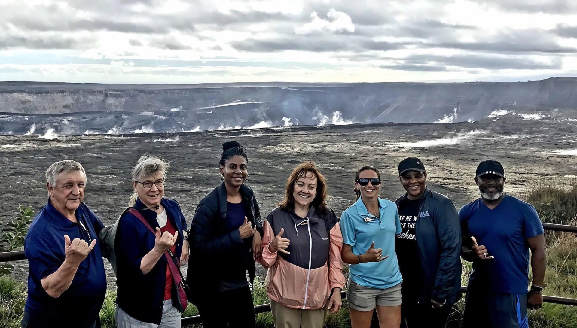 a group of people viewing an active volcano in hawaii