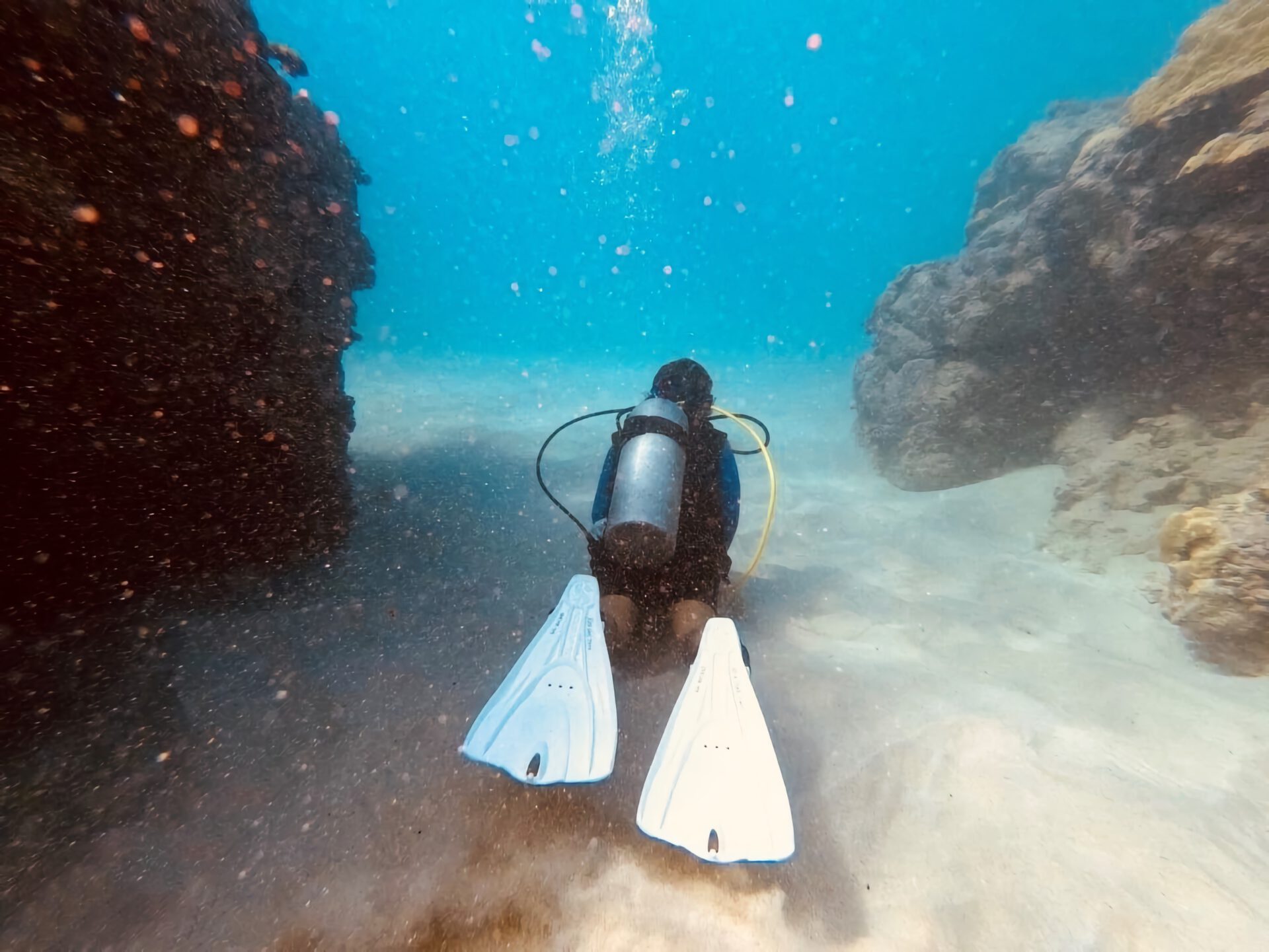 scuba diver lava tube and caves in hawaii