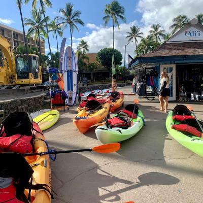 a group of people sitting at a beach