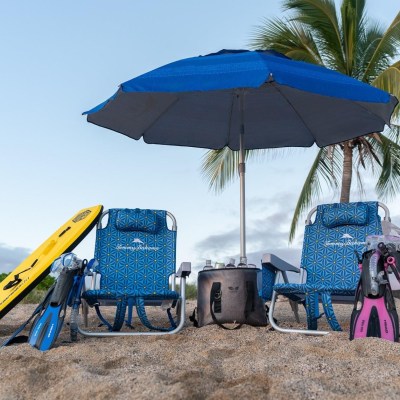 a group of lawn chairs sitting on a chair with a blue umbrella