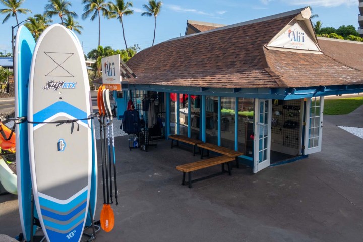 a train is parked on the side of a building
