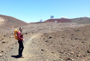 a person standing on top of a dirt field