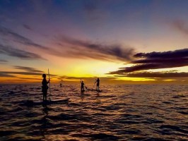 a sunset over a body of water