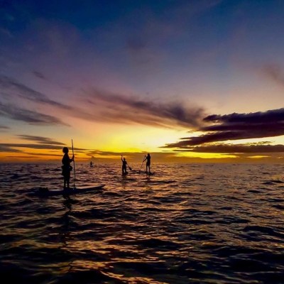 a sunset over a body of water