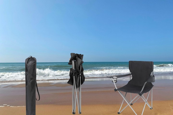 a chair sitting in front of a beach