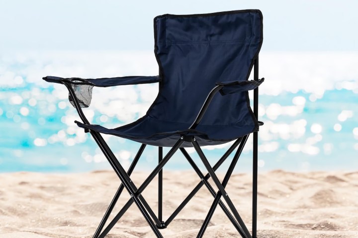 a chair sitting in front of a body of water