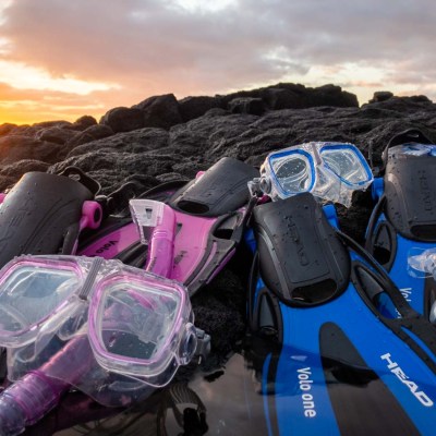 a group of people sitting on a motorcycle