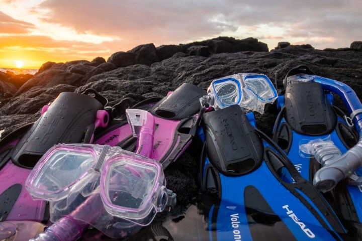 a group of people sitting on a motorcycle