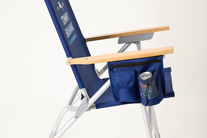 Blue folding chair with armrests, side pouch, and drink holder.