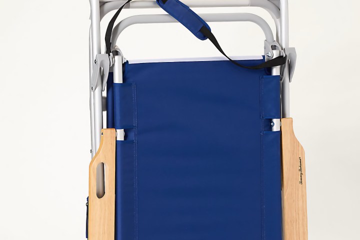 Folded blue and wooden beach chair with carrying strap.