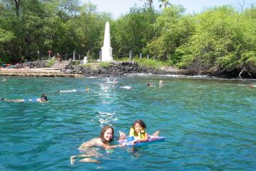 a group of people swimming in a body of water